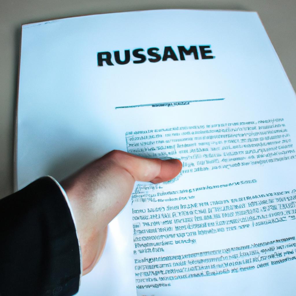 Person holding resume, shaking hands